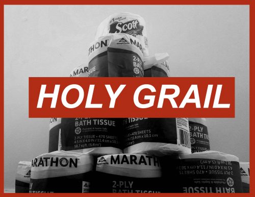 Stack of toilet paper rolls with Scott and Marathon brands labeled HOLY GRAIL in red text overlay during shortage