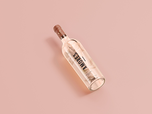 Smirnoff vodka bottle on pink background - premium clear spirit alcohol beverage product photography