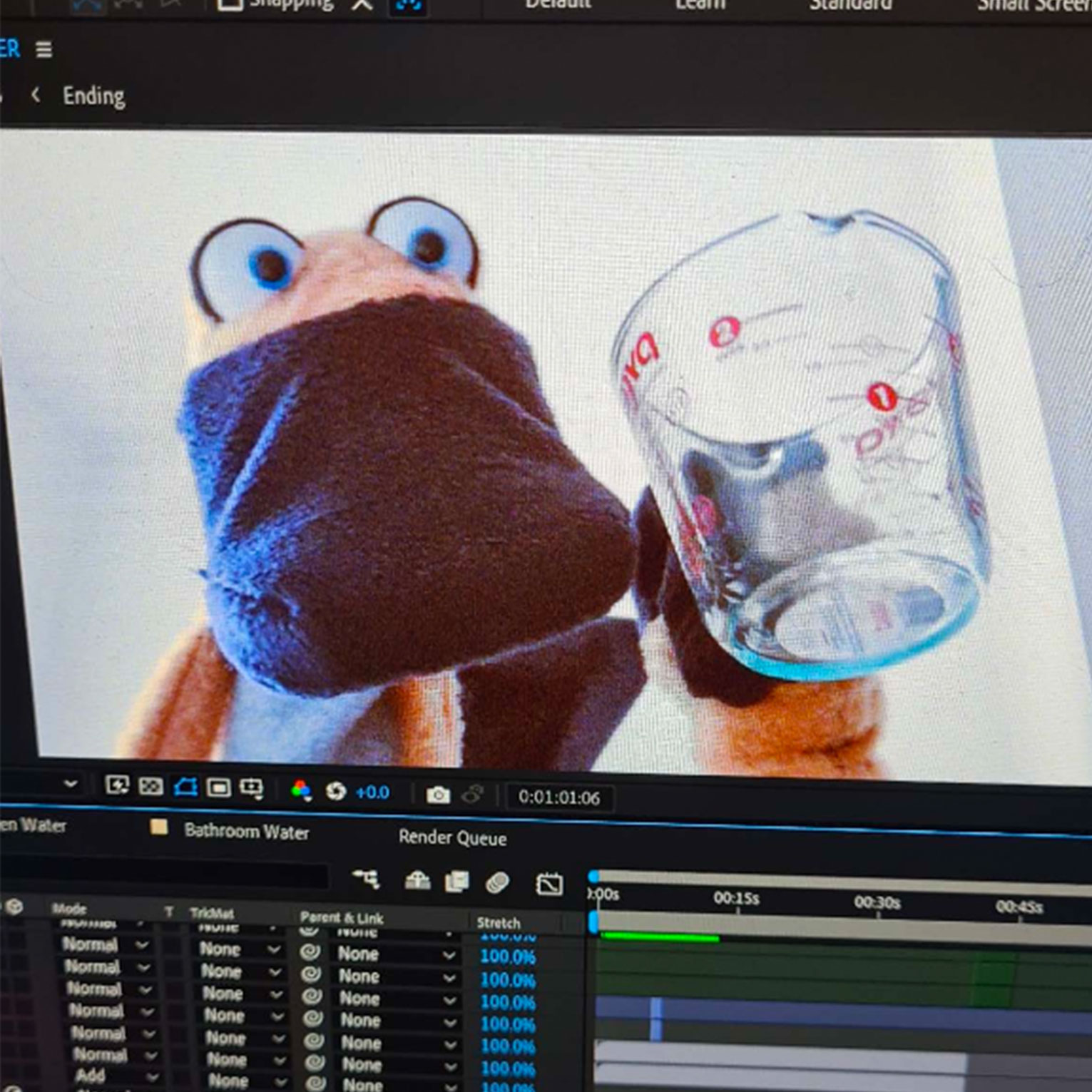 3D animated frog character holding glass of water in Blender rendering software interface with timeline and controls visible